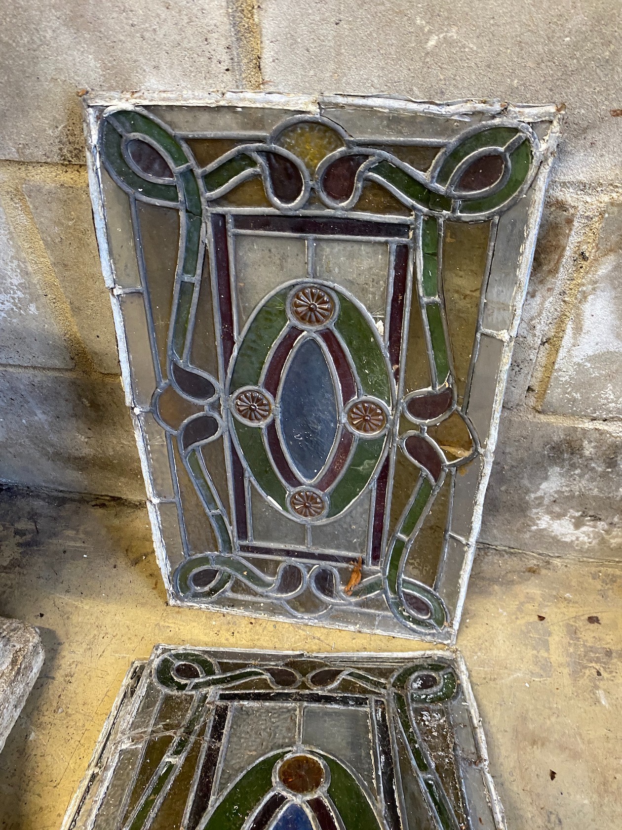 Four rectangular stained glass panels, each width 33cm, height 53cm